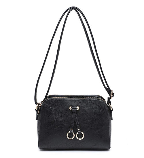 Black textured shoulder bag with a top zipper, double hanging loops with gold-tone rings, and a thin shoulder strap, shown on a plain white background.