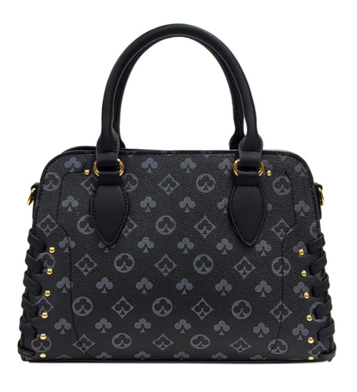 Front view of a black patterned grab bag with twin handles, gold-tone fittings and lace-up side details.