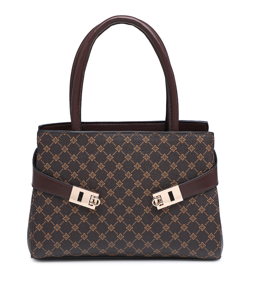 A structured handbag with a dark brown and tan monogram pattern, dark brown handles and trim, and gold-tone hardware, shown against a plain white background.