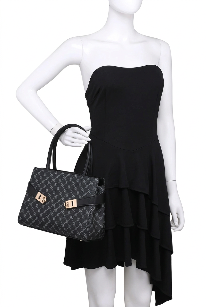 A black strapless dress displayed on a white mannequin, holding a black monogram handbag with gold-tone hardware against a plain white background.