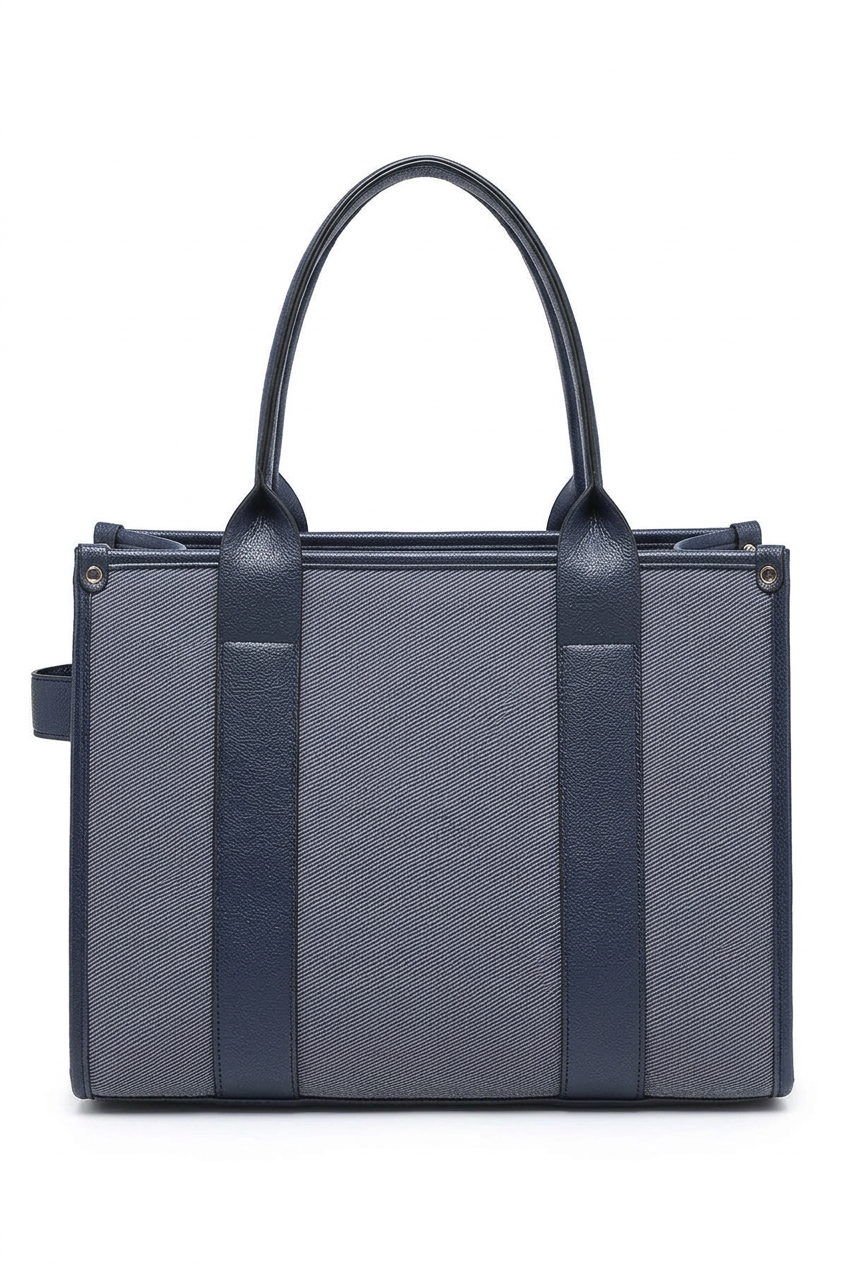 A structured tote bag in textured dark gray and navy blue leather, featuring two top handles and a zip-around top closure, shown against a plain white background.