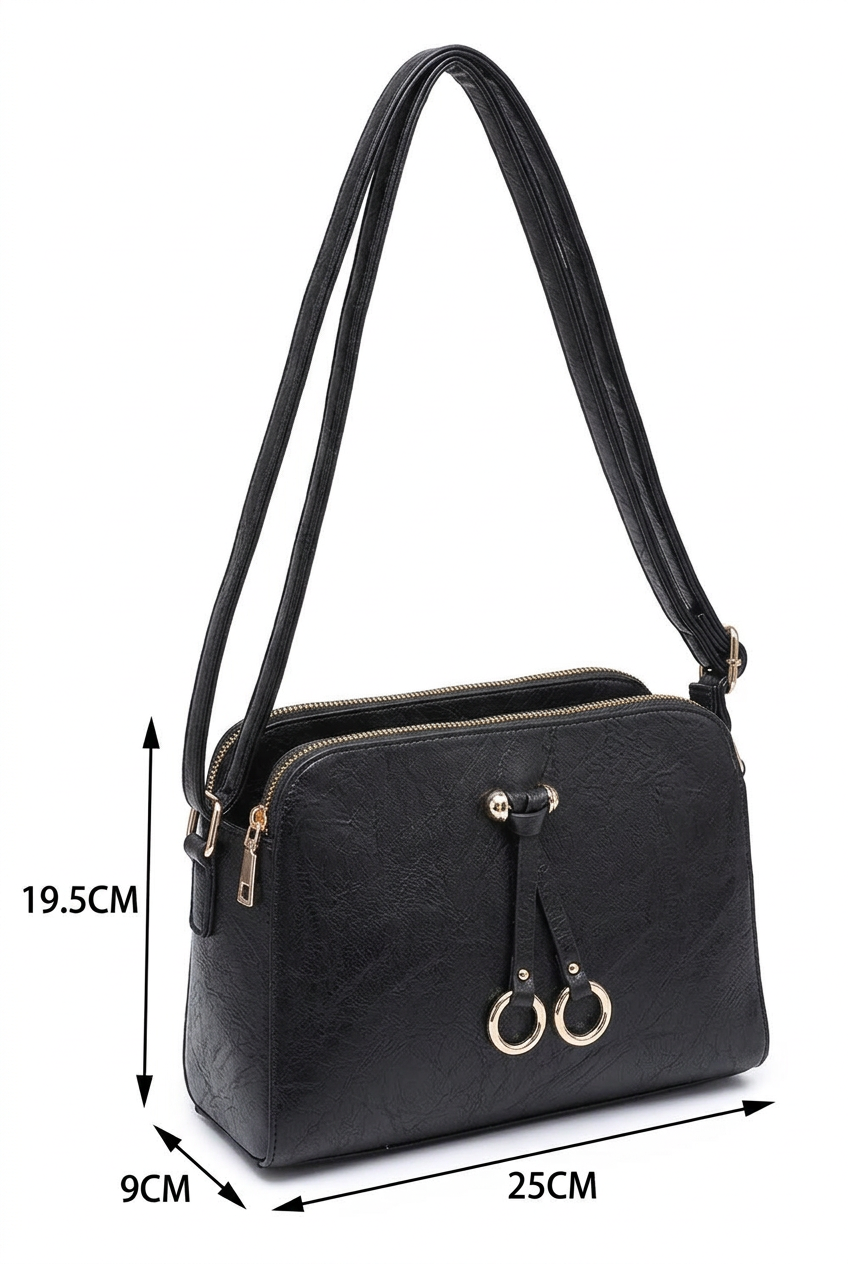 Black shoulder bag with dual zipper compartments and gold-tone hardware, shown with dimension arrows and labels indicating 19.5 cm height, 9 cm width, and 25 cm depth on a white background.