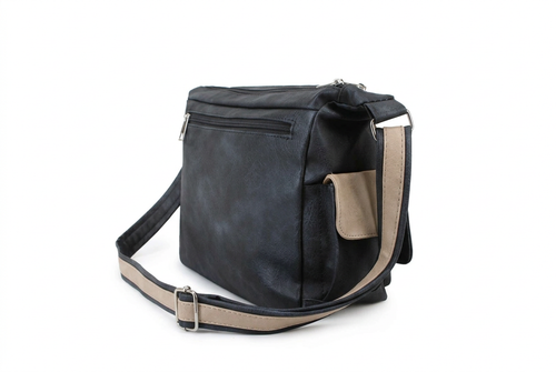 A black faux leather crossbody bag with a beige webbed strap and a beige side pocket, shown on a plain white background.