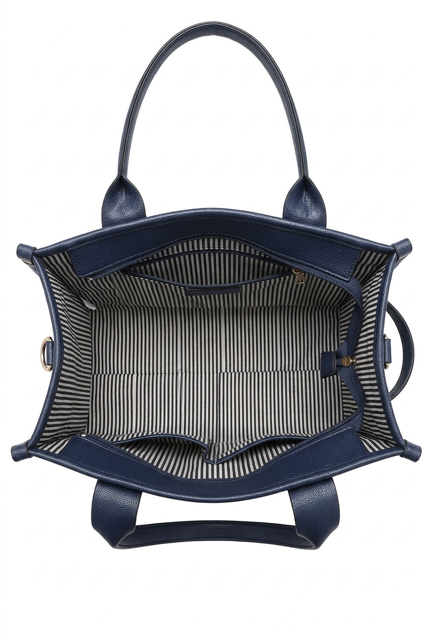 Top-down view of a navy blue tote bag showing its striped interior lining and double top handles against a white background.