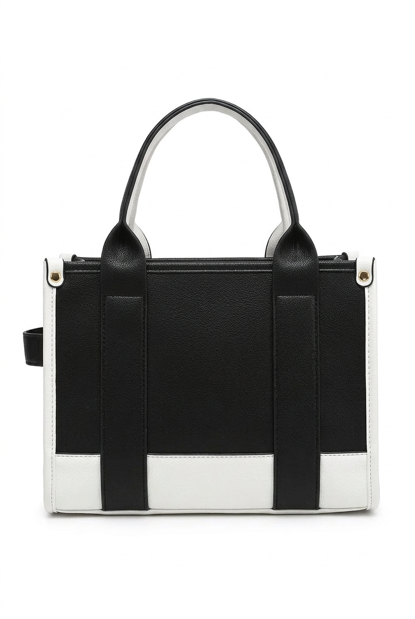 A structured black and white handbag with double top handles, a top zipper closure, and a small black side tag, shown against a plain white background.