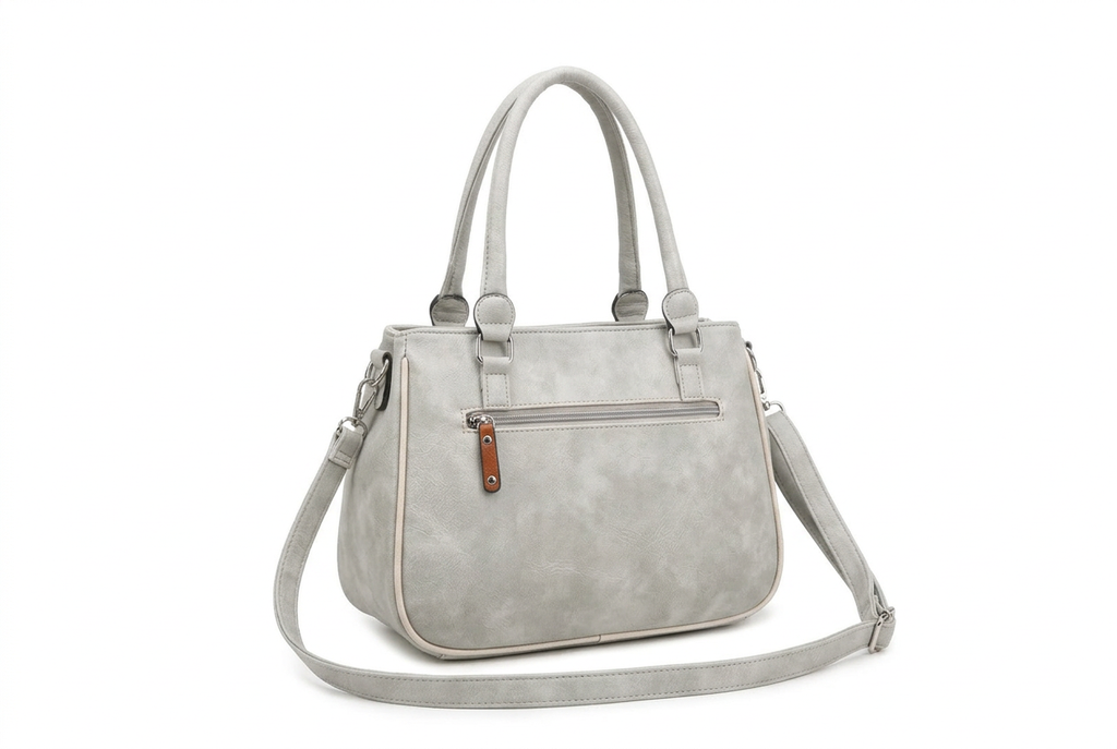A light gray faux-leather handbag with dual top handles, a front zippered pocket, and a detachable shoulder strap, shown on a plain white background.