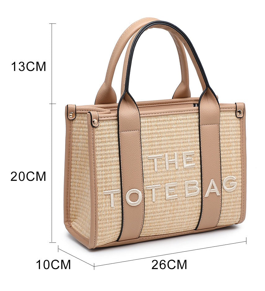 A beige woven tote bag with tan leather handles and trim, featuring the text 'THE TOTE BAG' in white. The image includes dimension lines and labels showing measurements of 13CM, 20CM, 10CM, 26CM, and 26CM on a white background.