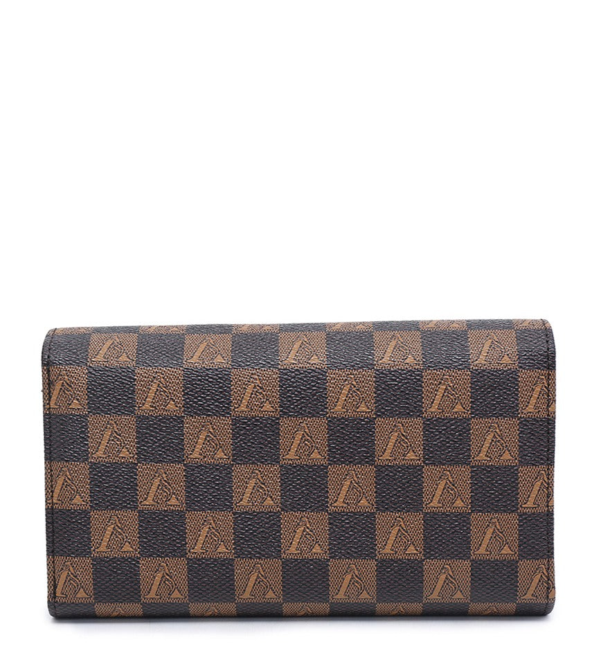 A wallet in the brand's classic Damier Ebene checkered pattern, featuring alternating dark brown and tan squares with embossed V logos, shown against a plain white background.
