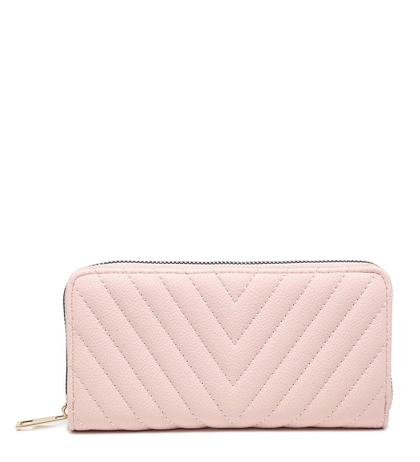 A light pink quilted zip-around wallet with a chevron pattern and gold-tone zipper pull, shown on a plain white background.