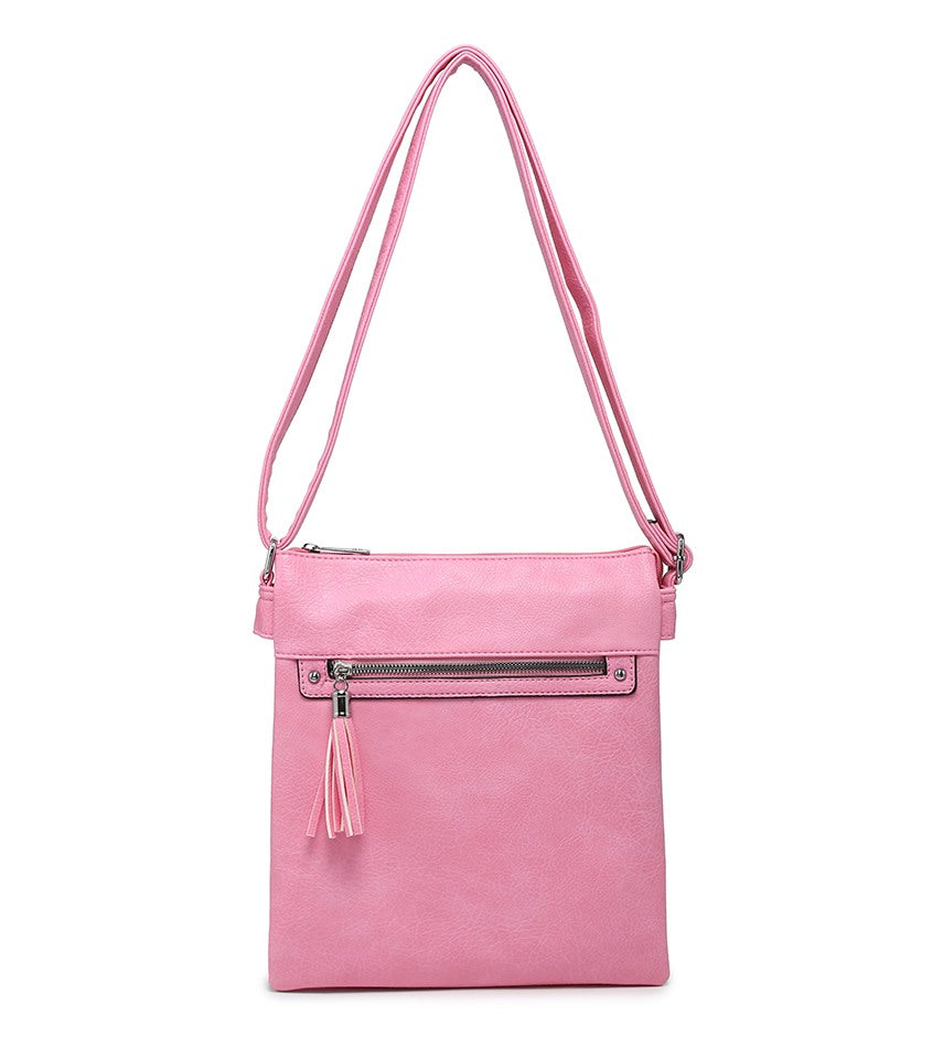 A pink crossbody bag with a front zippered pocket, silver-tone hardware, and a matching pink tassel, shown against a plain white background.