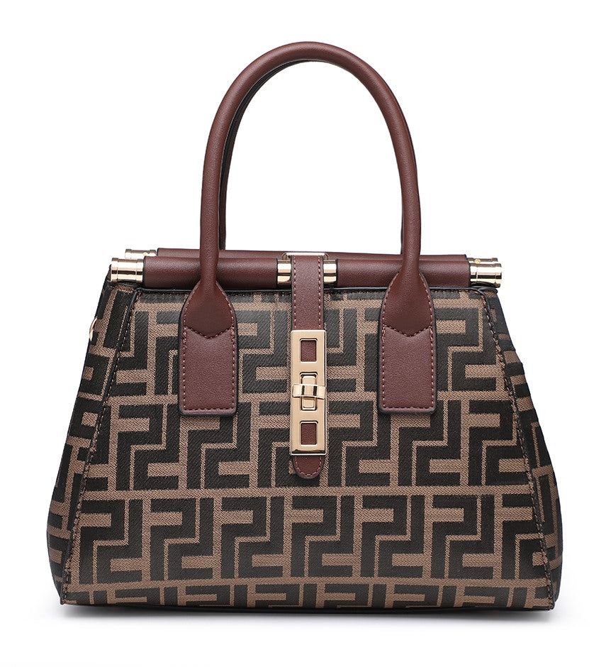A structured handbag with a brown and beige geometric monogram pattern, dark brown handles and trim, and gold-tone hardware, shown on a plain white background.