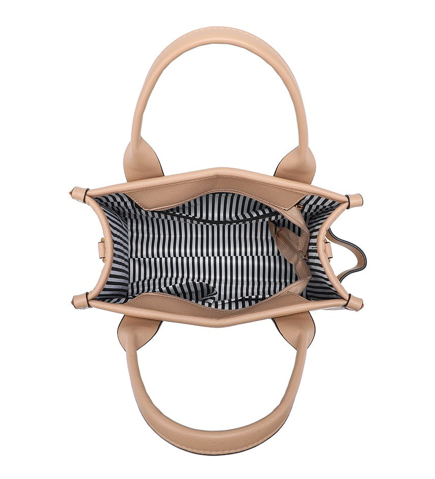 Top-down view of a structured handbag with light beige leather handles and trim, featuring a black and white striped fabric lining.
