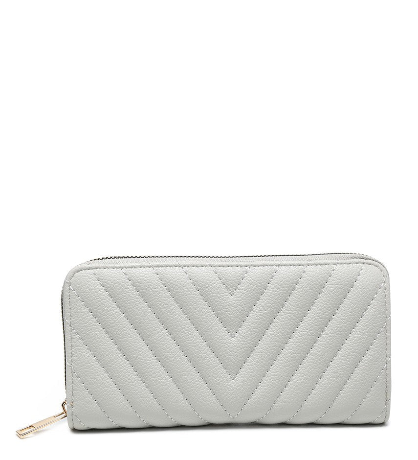 A light gray pebbled zip-around wallet with a quilted chevron pattern and a gold-tone zipper pull, shown on a plain white background.