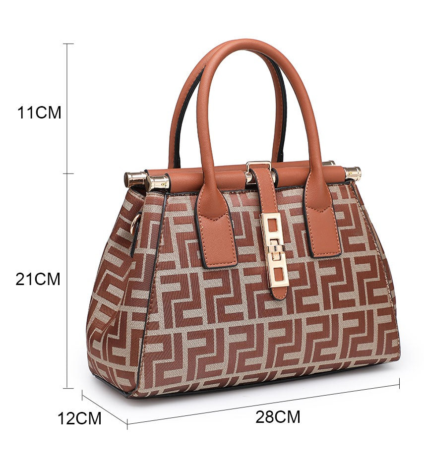 Brown patterned handbag showing measurements: 28 cm wide, 12 cm deep, 21 cm body height and 11 cm handle height