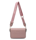 A dusty pink leather shoulder bag with a matching adjustable webbed strap. The bag features the text 'THE TOTE BAG' embossed on the front and printed on the strap, with gold-tone hardware.